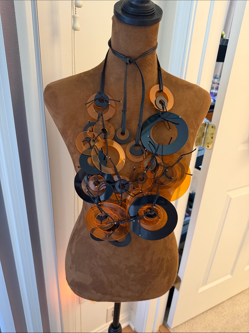 Designer leather and acrylic amber and black adjustable necklace.